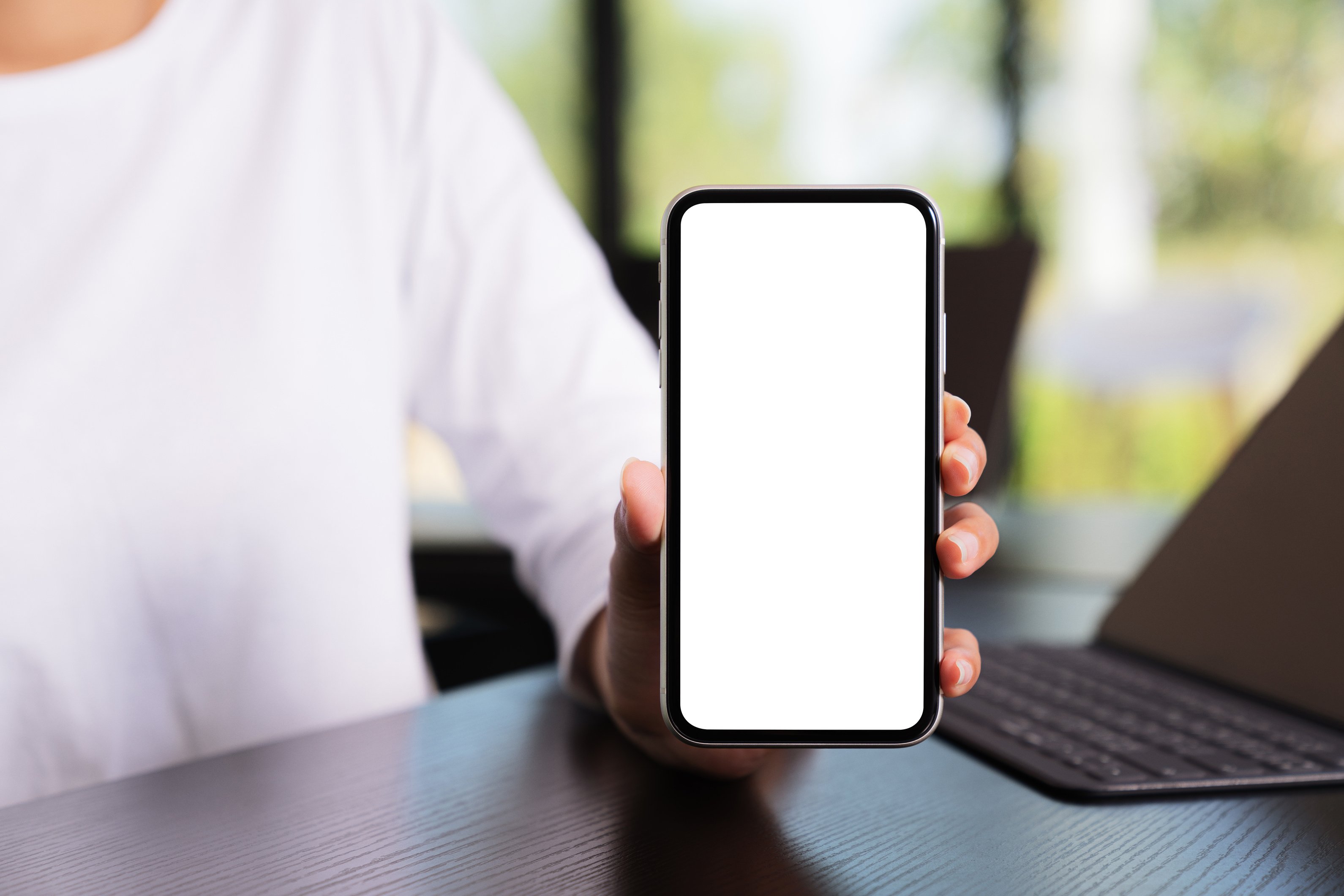 Person Holding Mobile Phone with Blank Screen